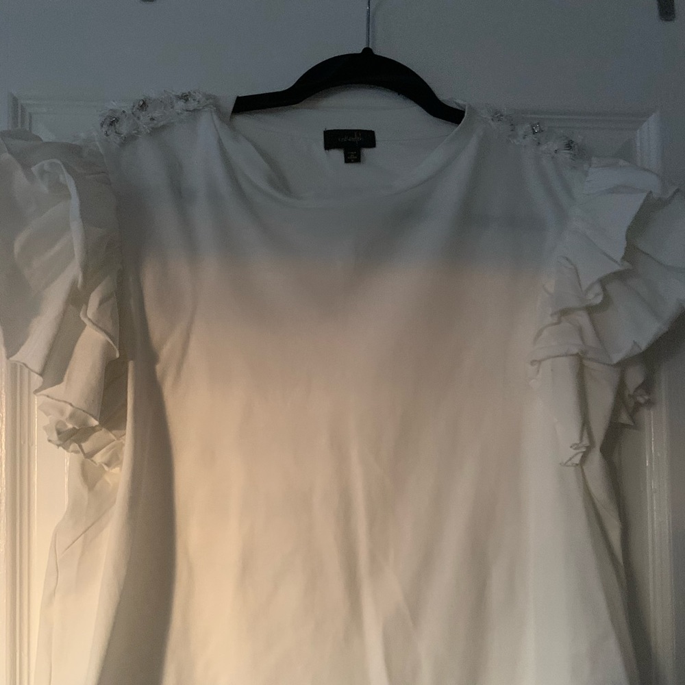 Shirt with design on shoulder